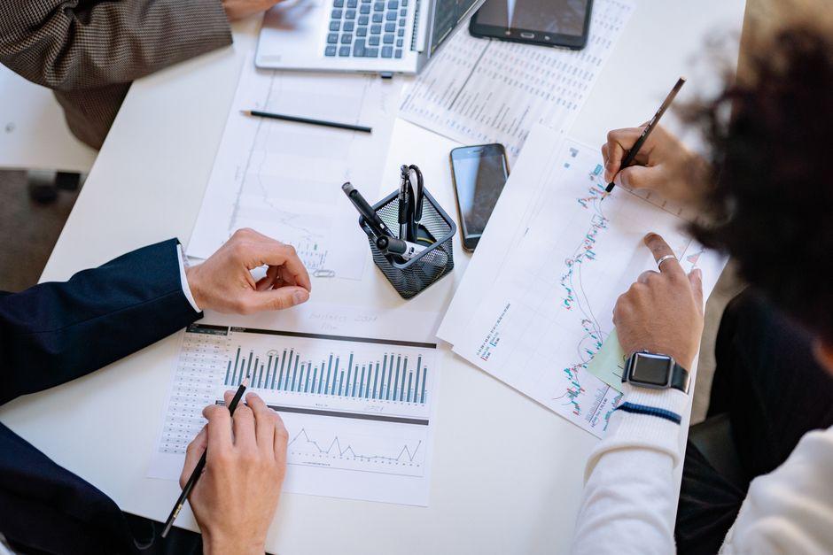People reviewing charts together during a meeting